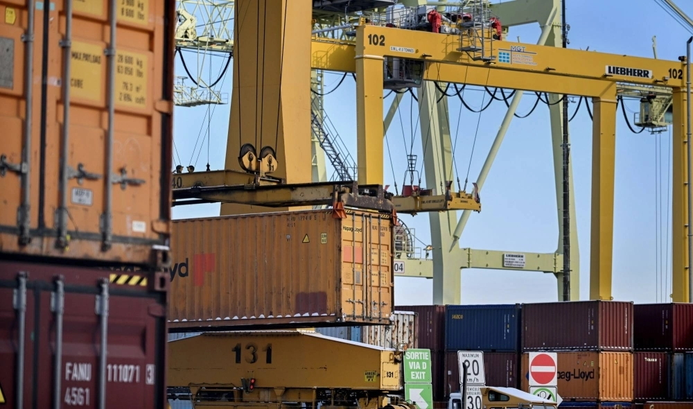 A crane moves containers in Montreal on Jan. 17. A crane moves containers in Montreal on Jan. 17.