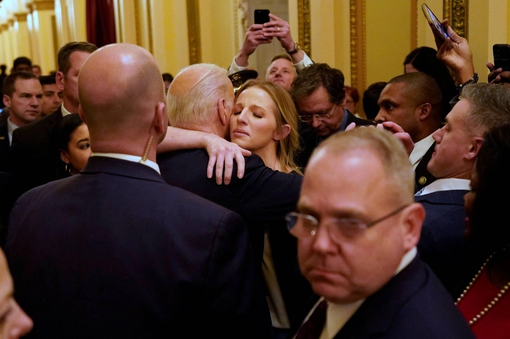 American President Joe Biden hugs Brittany Alkonis after giving a State of the Union in February. The wife of jailed U.S. sailor Lt. Ridge Alkonis ran a successful pressure campaign to get her husband released from a Japanese prison into American custody.  American President Joe Biden hugs Brittany Alkonis after giving a State of the Union in February. The wife of jailed U.S. sailor Lt. Ridge Alkonis ran a successful pressure campaign to get her husband released from a Japanese prison into American custody.