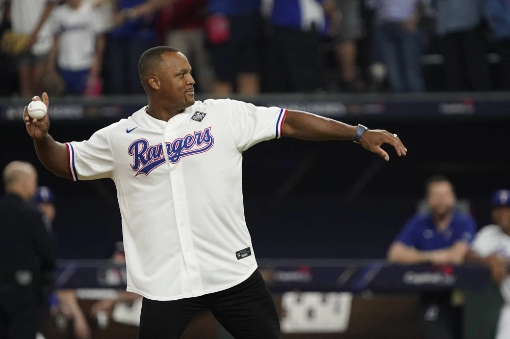 Former Rangers star Adrian Beltre throws out the ceremonial first pitch before a World Series game at Globe Life Field in Arlington, Texas, on Oct. 28. Former Rangers star Adrian Beltre throws out the ceremonial first pitch before a World Series game at Globe Life Field in Arlington, Texas, on Oct. 28.
