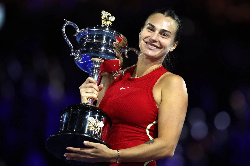 Aryna Sabalenka celebrates with the trophy after winning her second-straight Australian Open women's singles title on Saturday in Melbourne.  Aryna Sabalenka celebrates with the trophy after winning her second-straight Australian Open women's singles title on Saturday in Melbourne.