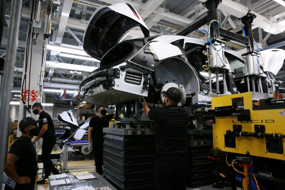 Workers assemble electric vehicles at the Lucid Motors plant in Casa Grande, Arizona, in September 2021. Workers assemble electric vehicles at the Lucid Motors plant in Casa Grande, Arizona, in September 2021.