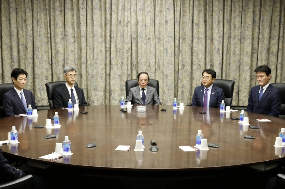 Bank of Japan Gov. Kazuo Ueda (center) attends a monetary policy meeting at the central bank's headquarters in Tokyo on Jan. 23. Bank of Japan Gov. Kazuo Ueda (center) attends a monetary policy meeting at the central bank's headquarters in Tokyo on Jan. 23.