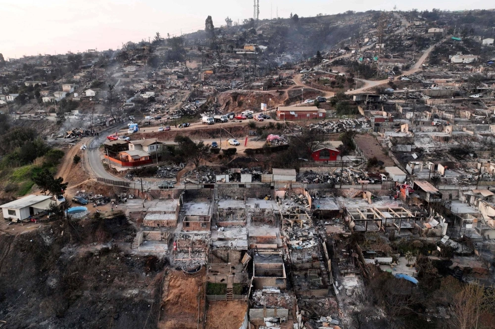The aftermath of a wildfire in Villa Independencia, Valparaiso region, Chile on Sunday. The aftermath of a wildfire in Villa Independencia, Valparaiso region, Chile on Sunday.