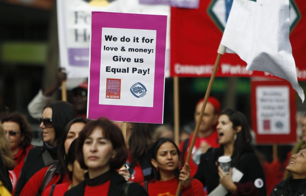 Women workers demand equal pay during a protest in Melbourne. Women workers demand equal pay during a protest in Melbourne.