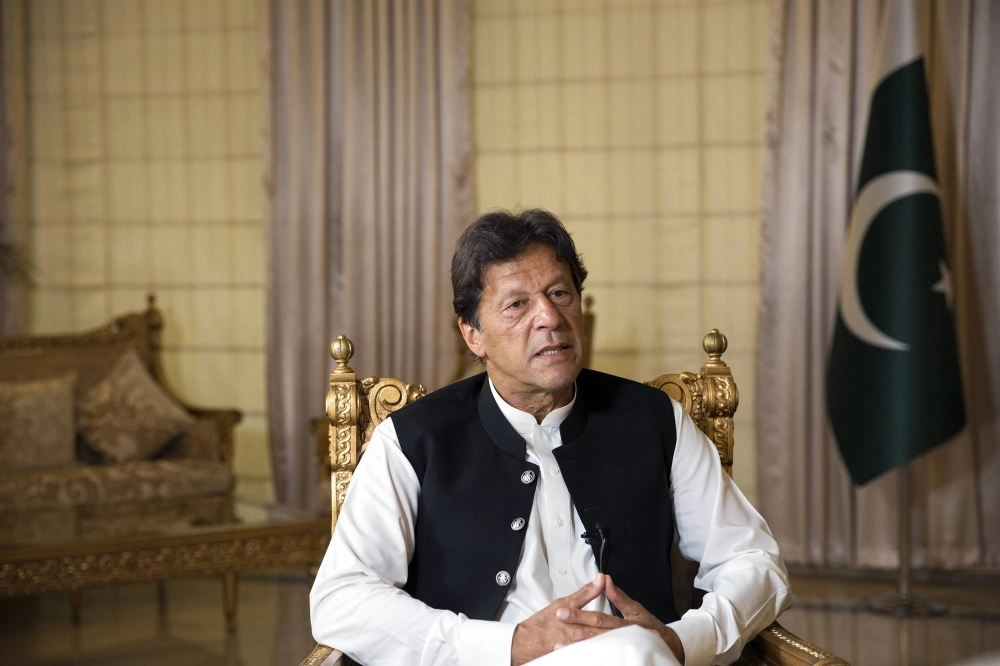 Former Prime Minister of Pakistan Imran Khan, who is currently imprisoned, speaks with foreign journalists at his residence in Islamabad on April 9, 2019.  Former Prime Minister of Pakistan Imran Khan, who is currently imprisoned, speaks with foreign journalists at his residence in Islamabad on April 9, 2019.