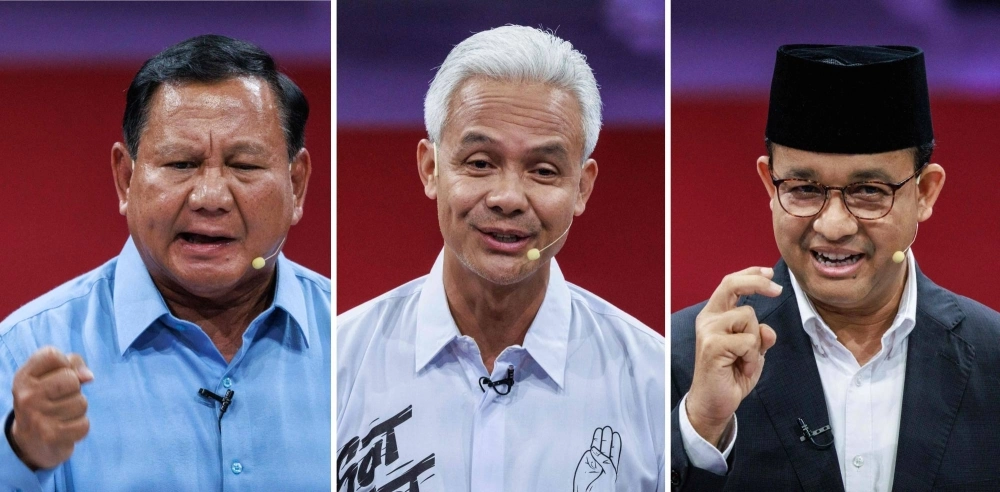 Indonesia's presidential candidates Ganjar Pranowo (L), Prabowo Subianto (C) and Anies Baswedan (R) speaking during the first presidential election debate in Jakarta on Dec. 12, 2023. Indonesia's presidential election will be held on February 14, 2024 with three candidates battling to lead Southeast Asia's biggest economy and the third-largest democracy in the world. Indonesia's presidential candidates Ganjar Pranowo (L), Prabowo Subianto (C) and Anies Baswedan (R) speaking during the first presidential election debate in Jakarta on Dec. 12, 2023. Indonesia's presidential election will be held on February 14, 2024 with three candidates battling to lead Southeast Asia's biggest economy and the third-largest democracy in the world.
