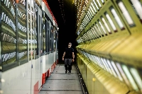 Staff checks metering instruments during a sun simulation at the Rail Tec Arsenal facility in Vienna | Bloomberg