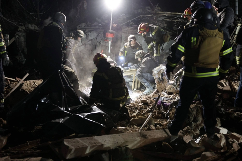 Ukrainian police officers and rescue workers clear away the rubble of a destroyed house after a Russian rocket attack in Kramatorsk, Donetsk region, on Saturday.  Ukrainian police officers and rescue workers clear away the rubble of a destroyed house after a Russian rocket attack in Kramatorsk, Donetsk region, on Saturday.