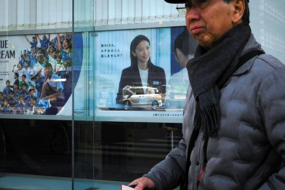 An advertisement for the Nippon Individual Savings Account (NISA) at a Mizuho Bank branch, a unit of Mizuho Financial Group, in Tokyo on Jan. 31. An advertisement for the Nippon Individual Savings Account (NISA) at a Mizuho Bank branch, a unit of Mizuho Financial Group, in Tokyo on Jan. 31.