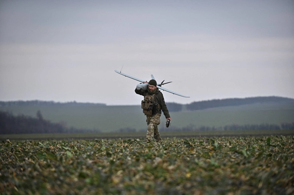 A Ukrainian serviceman carries a Leleka reconnaissance unmanned aerial vehicle (UAV) in Zaporizhzhia region, Ukraine, on Feb. 15 A Ukrainian serviceman carries a Leleka reconnaissance unmanned aerial vehicle (UAV) in Zaporizhzhia region, Ukraine, on Feb. 15