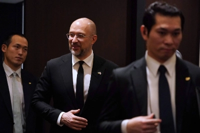 Ukrainian Prime Minister Denys Shmyhal is flanked by security personnel as he arrives at the Foreign Correspondents' Club of Japan for a news conference in Tokyo on Tuesday. Ukrainian Prime Minister Denys Shmyhal is flanked by security personnel as he arrives at the Foreign Correspondents' Club of Japan for a news conference in Tokyo on Tuesday.