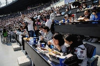 Fans during a game between the Hanwha Eagles and Doosan Bears at Jamsil Baseball Stadium in Seoul in April 2022.  | Reuters