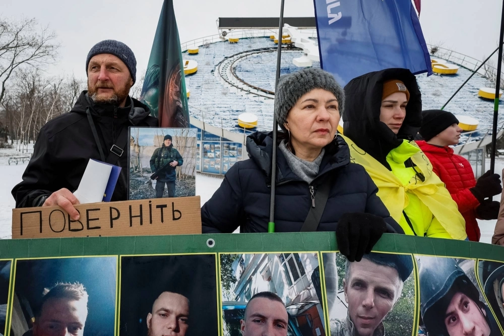 Yurii, 53, and Tetiana, 51, attend a rally of families of Ukrainian prisoners of war  in Kryvyi Rih, Dnipropetrovsk region, Ukraine, on Jan. 21. Yurii, 53, and Tetiana, 51, attend a rally of families of Ukrainian prisoners of war  in Kryvyi Rih, Dnipropetrovsk region, Ukraine, on Jan. 21.