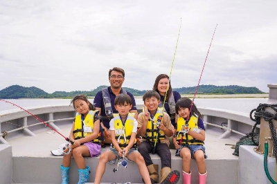 Yasuhiro Otomo and Miku Narisawa during one of Odyssey Nature Japan's educational fishing programs. Yasuhiro Otomo and Miku Narisawa during one of Odyssey Nature Japan's educational fishing programs.