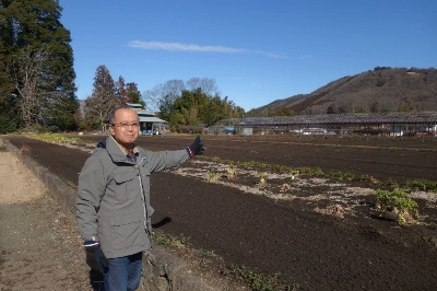 Hideo Shimoju points to a possible site that his fellow neighbors may relocate to. Such relocations have happened before, but not preemptively. Hideo Shimoju points to a possible site that his fellow neighbors may relocate to. Such relocations have happened before, but not preemptively.