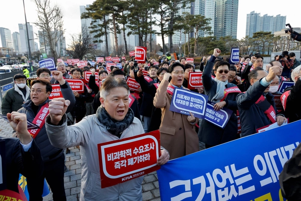 South Korean doctors take part in a protest against the government medical policy in front of the Presidential office in Seoul on Sunday. South Korean doctors take part in a protest against the government medical policy in front of the Presidential office in Seoul on Sunday.