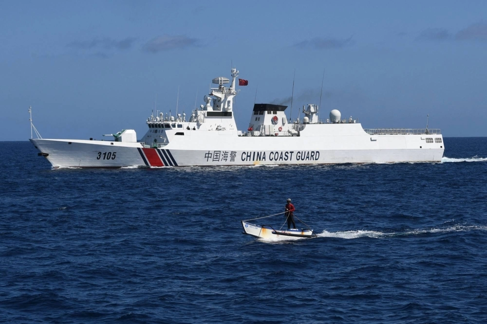 A Chinese coast guard ship near the China-controlled Scarborough Shoal, in disputed waters of the South China Sea on Feb. 16.  A Chinese coast guard ship near the China-controlled Scarborough Shoal, in disputed waters of the South China Sea on Feb. 16.