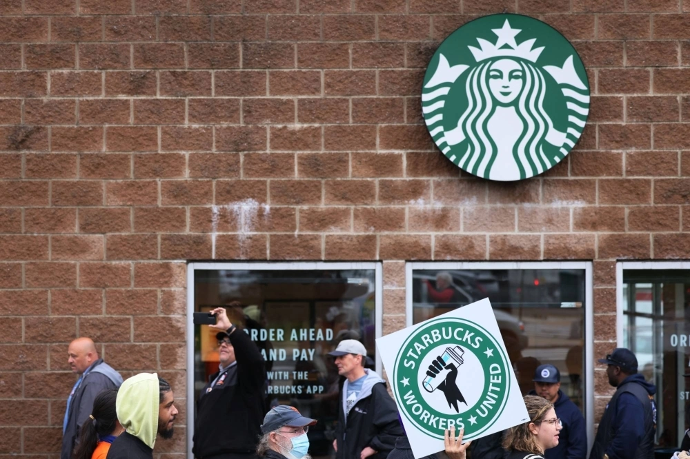 Starbucks workers hold a rally in New York City in 2022. Starbucks workers hold a rally in New York City in 2022.