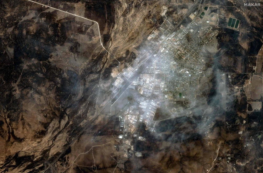 A satellite image of the town of Canadian, Texas, on Wednesday. Seven wildfires were raging in Texas, including one of the largest in recent state history, authorities said Wednesday.  A satellite image of the town of Canadian, Texas, on Wednesday. Seven wildfires were raging in Texas, including one of the largest in recent state history, authorities said Wednesday.