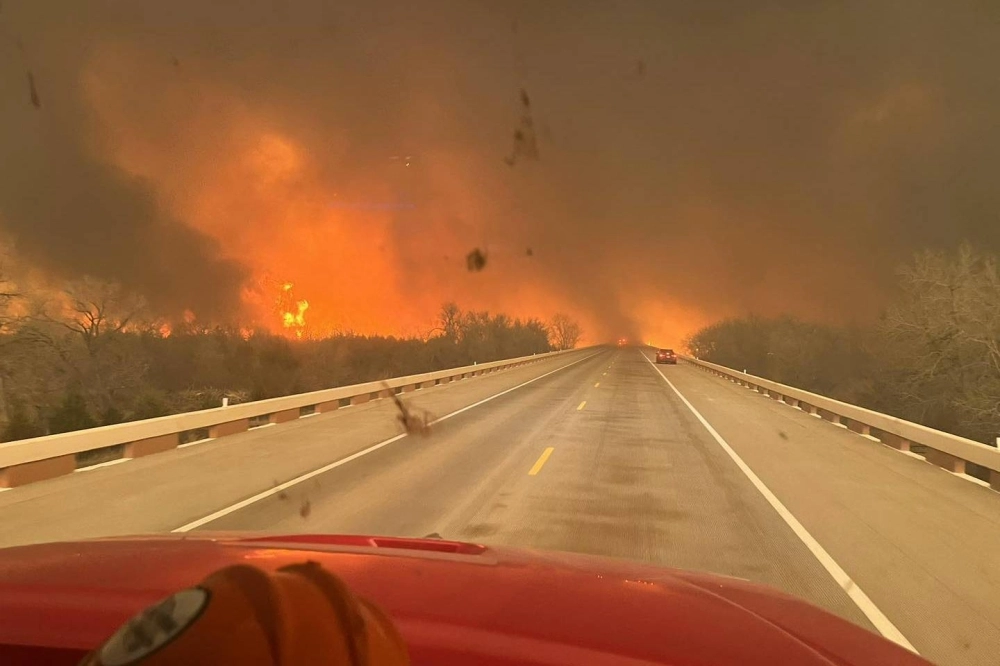 A fire truck drives toward the Smokehouse Creek Fire, near Amarillo, in the Texas Panhandle on Tuesday. A fire truck drives toward the Smokehouse Creek Fire, near Amarillo, in the Texas Panhandle on Tuesday.