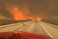 A fire truck drives toward the Smokehouse Creek Fire, near Amarillo, in the Texas Panhandle on Tuesday. | Greenville Professional Firefighters Association / via AFP-Jiji