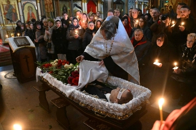 The body of late Russian opposition leader Alexei Navalny is seen during the funeral service at the Mother of God Quench My Sorrows Church in Moscow's Maryino district on Friday. The body of late Russian opposition leader Alexei Navalny is seen during the funeral service at the Mother of God Quench My Sorrows Church in Moscow's Maryino district on Friday.