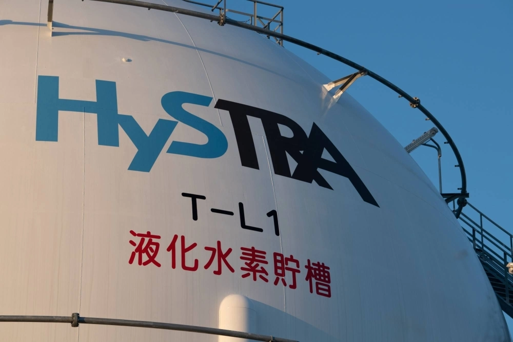 A hydrogen storage tank at the liquefied hydrogen receiving terminal on Kobe Airport Island in Kobe in October 2020. Japan’s plan to facilitate the research and development of hydrogen co-firing has been criticized by a number of environmental groups who see it as a move to prolong the life of coal-fired plants. A hydrogen storage tank at the liquefied hydrogen receiving terminal on Kobe Airport Island in Kobe in October 2020. Japan’s plan to facilitate the research and development of hydrogen co-firing has been criticized by a number of environmental groups who see it as a move to prolong the life of coal-fired plants.