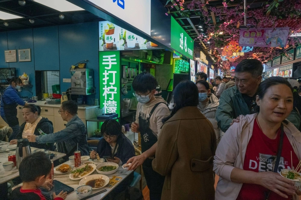 The Dongmenting night market in Shenzhen, China, on Feb. 12. Hong Kong residents are flocking to nearby mainland cities in record numbers for cheaper shopping and entertainment. The Dongmenting night market in Shenzhen, China, on Feb. 12. Hong Kong residents are flocking to nearby mainland cities in record numbers for cheaper shopping and entertainment.