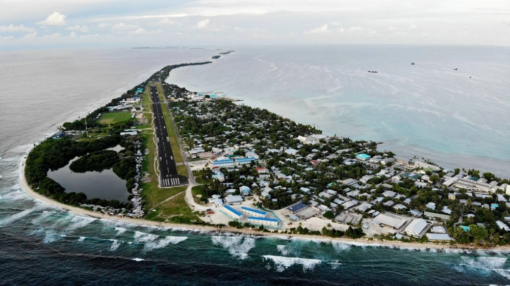 An aerial view of downtown Funafuti and the airport runway in 2019 An aerial view of downtown Funafuti and the airport runway in 2019