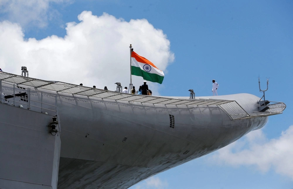 Indian Navy officers stand on the flight deck of India's first home-built aircraft carrier INS Vikrant in Kochi, India, in September 2022. Indian Navy officers stand on the flight deck of India's first home-built aircraft carrier INS Vikrant in Kochi, India, in September 2022.
