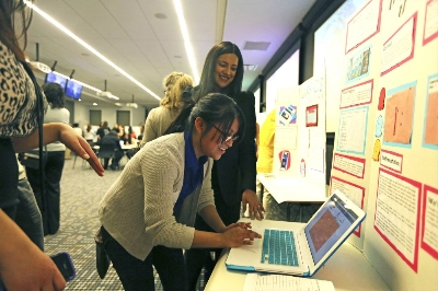 An event for female coders in New York in 2013. Women’s full participation is key to ensure technologies like AI help bridge the gender gap. An event for female coders in New York in 2013. Women’s full participation is key to ensure technologies like AI help bridge the gender gap.