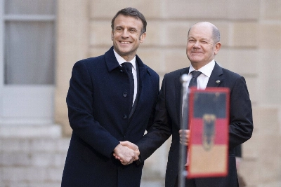 French President Emmanuel Macron greets Germany Chancellor Olaf Scholz at the Elysee Palace in Paris on Feb. 26. French President Emmanuel Macron greets Germany Chancellor Olaf Scholz at the Elysee Palace in Paris on Feb. 26.