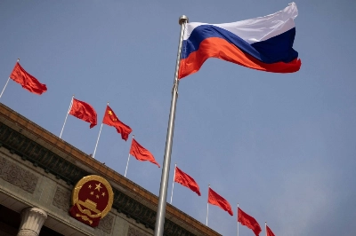 The Russian national flag flies in front of the Great Hall of the People in Beijing in May 2023. Trade between China and Russia has been increasing since the start of the Ukraine war.  The Russian national flag flies in front of the Great Hall of the People in Beijing in May 2023. Trade between China and Russia has been increasing since the start of the Ukraine war.