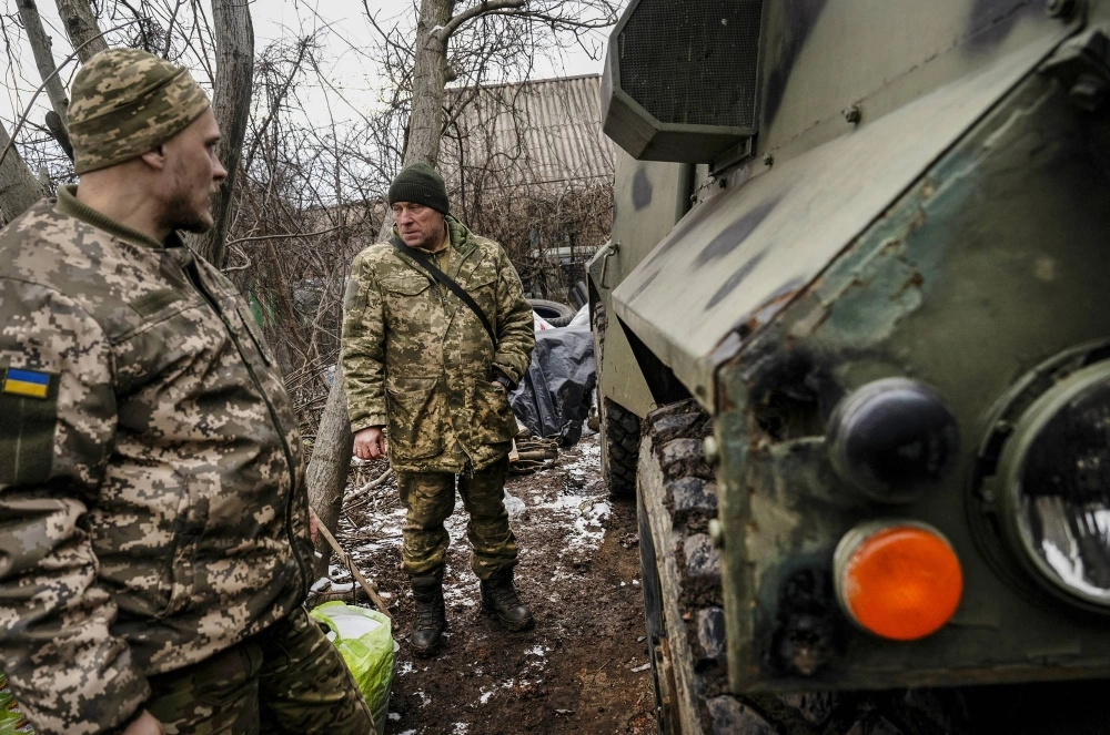 Ukrainian soldiers who recently pulled out of Avdiivka, Ukraine, replenish supplies in a nearby village on Feb. 19. Ukrainian soldiers who recently pulled out of Avdiivka, Ukraine, replenish supplies in a nearby village on Feb. 19.