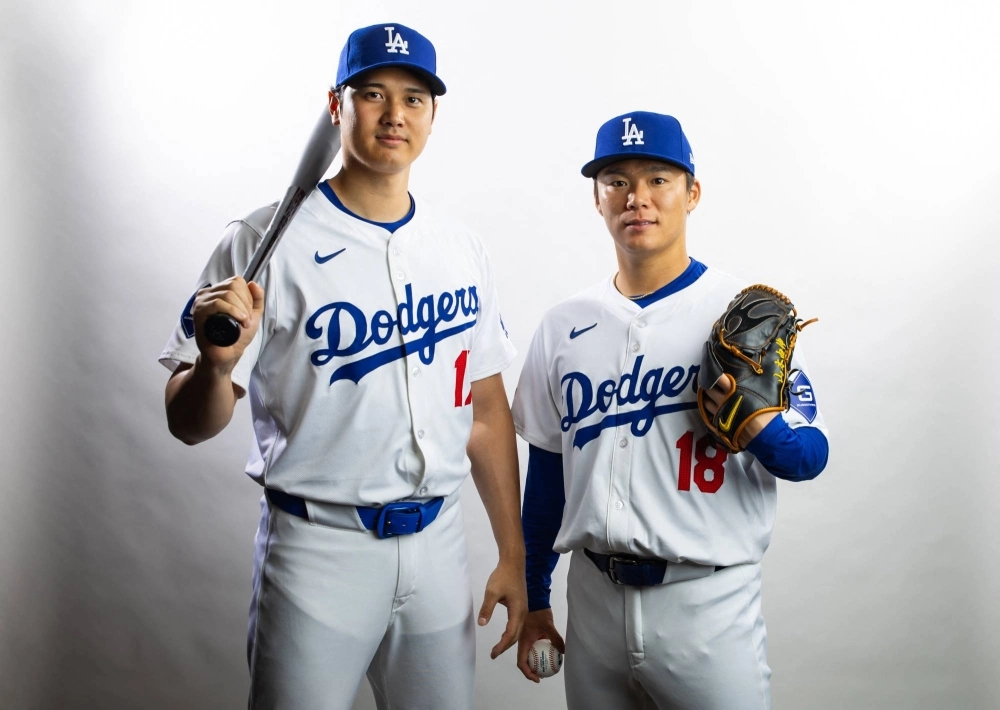 The Dodgers' Shohei Ohtani(left) and Yoshinobu Yamamoto pose for a portrait on media day at Camelback Ranch in Glendale, Arizona, on Feb. 21. The Dodgers' Shohei Ohtani(left) and Yoshinobu Yamamoto pose for a portrait on media day at Camelback Ranch in Glendale, Arizona, on Feb. 21.