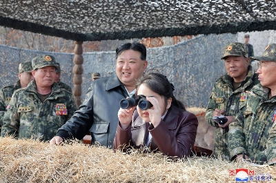 North Korean leader Kim Jong Un and his daughter inspect a drill by the Korean People's Army at an undisclosed location in North Korea in this image released Saturday.  North Korean leader Kim Jong Un and his daughter inspect a drill by the Korean People's Army at an undisclosed location in North Korea in this image released Saturday.