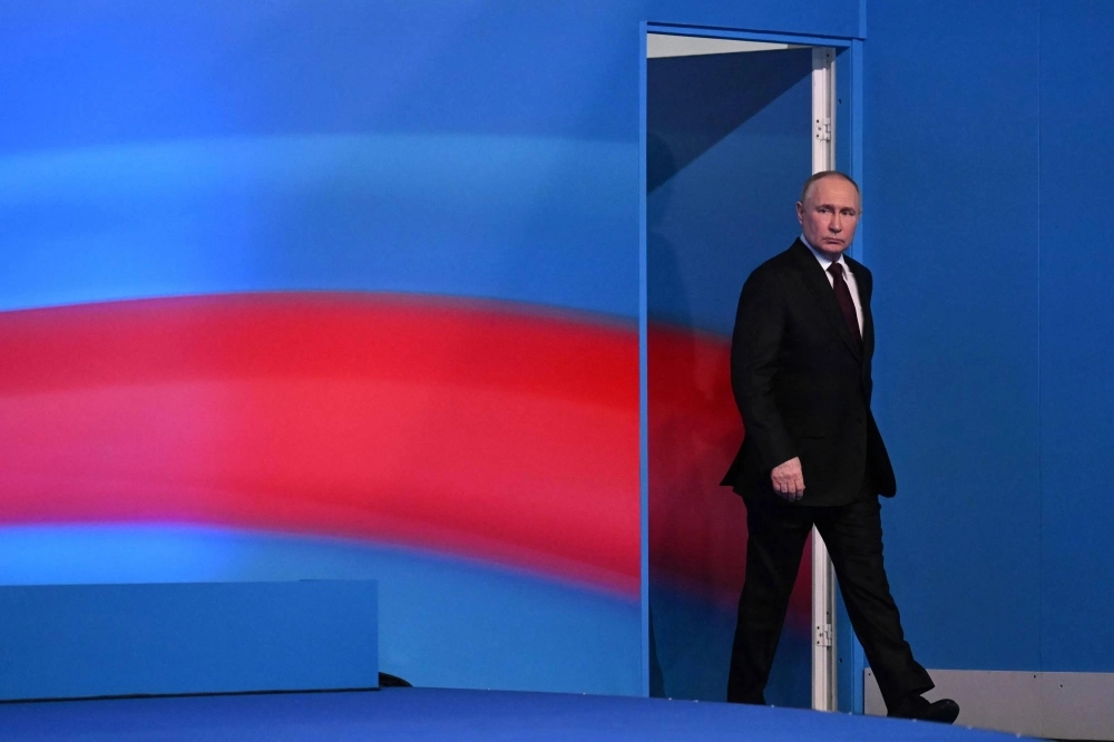 Russian President Vladimir Putin meets with the media at his campaign headquarters in Moscow on Monday.  Russian President Vladimir Putin meets with the media at his campaign headquarters in Moscow on Monday.