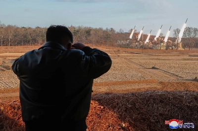North Korean leader Kim Jong Un watches a rocket salvo firing drill at an unconfirmed location in the country in this image released Tuesday. North Korean leader Kim Jong Un watches a rocket salvo firing drill at an unconfirmed location in the country in this image released Tuesday.