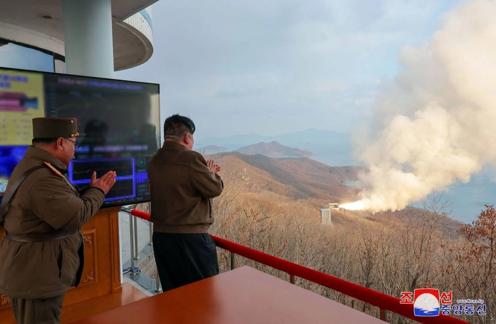 North Korean leader Kim Jong Un observs a ground test of a solid fuel engine for a new intermediate-range hypersonic missile, at the Sohae Satellite Launching Ground on North Korea’s western coast in this digitally altered image released Wednesday. North Korean leader Kim Jong Un observs a ground test of a solid fuel engine for a new intermediate-range hypersonic missile, at the Sohae Satellite Launching Ground on North Korea’s western coast in this digitally altered image released Wednesday.