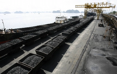 Containers transporting coal at a dock in Cam Pha, Vietnam. Enthusiasm for Vietnam’s renewables boom is dampened by factors such as its underdeveloped electricity grid and patchy regulatory framework, while the country’s major source of electricity remains coal. Containers transporting coal at a dock in Cam Pha, Vietnam. Enthusiasm for Vietnam’s renewables boom is dampened by factors such as its underdeveloped electricity grid and patchy regulatory framework, while the country’s major source of electricity remains coal.