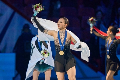 Japanese Gold medalist Kaori Sakamoto waves to fans during the women's victory ceremony during the World Figure Skating Championships in Montreal on Thursday. Japanese Gold medalist Kaori Sakamoto waves to fans during the women's victory ceremony during the World Figure Skating Championships in Montreal on Thursday.