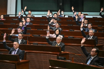 Legislative Council lawmakers in Hong Kong unanimously voted in favor of a new national security law on Tuesday. The legislation introduces penalties such as life imprisonment for crimes related to treason and insurrection. Legislative Council lawmakers in Hong Kong unanimously voted in favor of a new national security law on Tuesday. The legislation introduces penalties such as life imprisonment for crimes related to treason and insurrection.