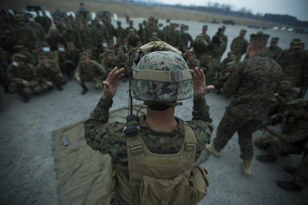A U.S. Marine prepares to demonstrate the use of night vision goggles to Ground Self-Defense Force troops at the GSDF's Camp Somagahara in Gunma Prefecture in March 2017. A U.S. Marine prepares to demonstrate the use of night vision goggles to Ground Self-Defense Force troops at the GSDF's Camp Somagahara in Gunma Prefecture in March 2017.
