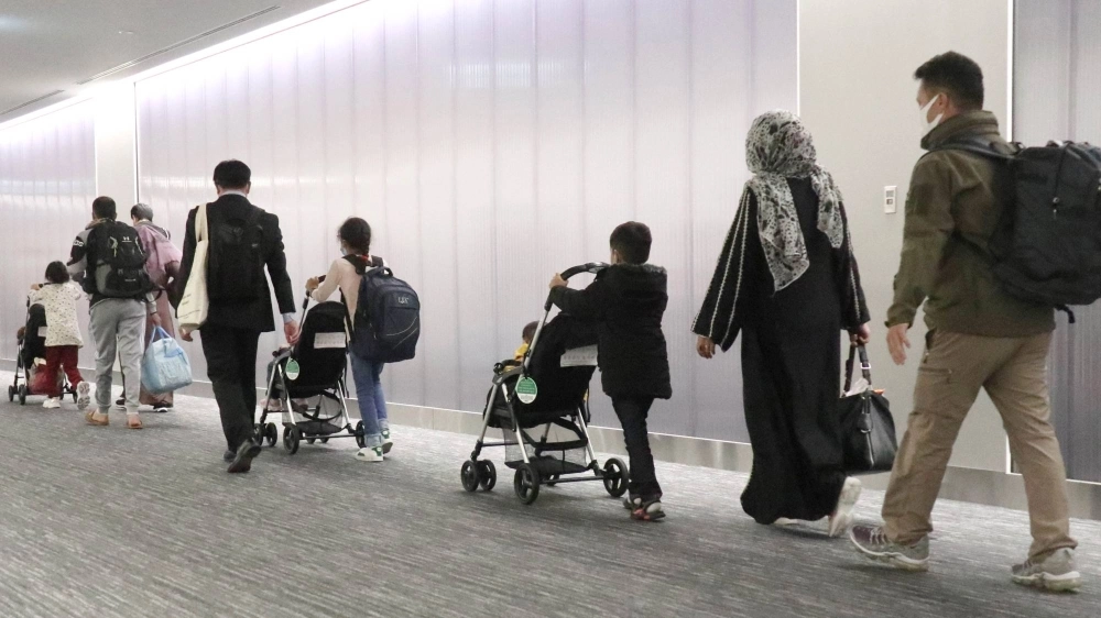 Afghan evacuees arrive at Narita International Airport in October 2021. Applicants from Afghanistan made up the majority of those recognized as refugees by the Japanese government last year, similar to 2022. Afghan evacuees arrive at Narita International Airport in October 2021. Applicants from Afghanistan made up the majority of those recognized as refugees by the Japanese government last year, similar to 2022.
