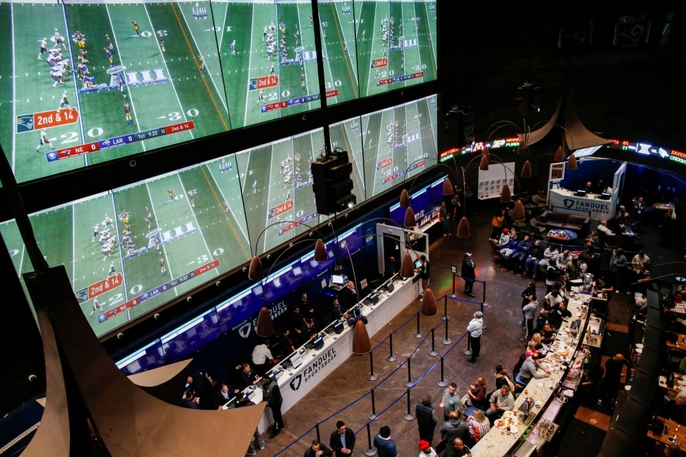 People place their bets at the Fanduel sportsbook in East Rutherford, New Jersey, during the Super Bowl in February 2019.  People place their bets at the Fanduel sportsbook in East Rutherford, New Jersey, during the Super Bowl in February 2019.