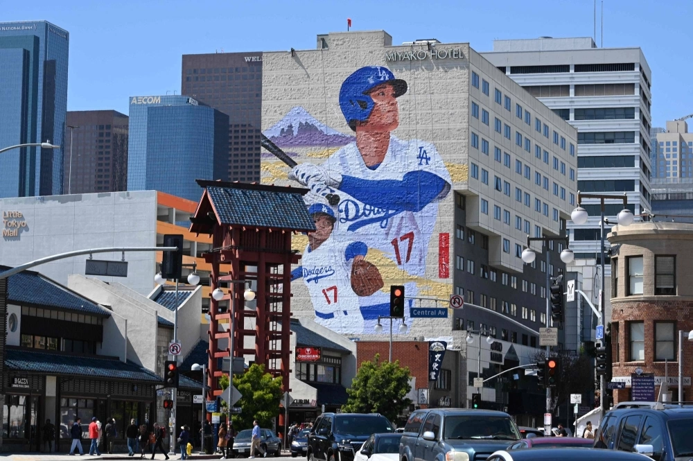 A mural showing Dodgers player Shohei Ohtani is seen on the side of the Miyako Hotel in Little Tokyo, downtown Los Angeles, on Thursday. The mural is by artist Robert Vargas and is 46 meters tall. A mural showing Dodgers player Shohei Ohtani is seen on the side of the Miyako Hotel in Little Tokyo, downtown Los Angeles, on Thursday. The mural is by artist Robert Vargas and is 46 meters tall.
