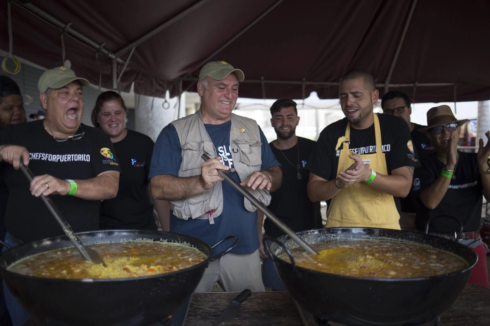 Chef Jose Andres (center) and local chefs stir large pots of paella destined for people struggling to find enough to eat in the wake of Hurricane Maria, in San Juan, Puerto Rico, in October 2017. Chef Jose Andres (center) and local chefs stir large pots of paella destined for people struggling to find enough to eat in the wake of Hurricane Maria, in San Juan, Puerto Rico, in October 2017.