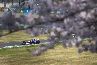 Japanese driver Yuki Tsunoda competes in the Japanese Grand Prix on Sunday as the race's spring debut saw cherry blossoms greet the 20 drivers on the Formula One grid.  Japanese driver Yuki Tsunoda competes in the Japanese Grand Prix on Sunday as the race's spring debut saw cherry blossoms greet the 20 drivers on the Formula One grid.