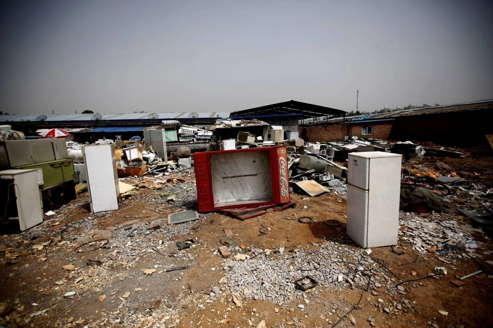 Broken fridges in the yard of a recycling workers' tenement house in Dongxiaokou village in Beijing in 2014 Broken fridges in the yard of a recycling workers' tenement house in Dongxiaokou village in Beijing in 2014