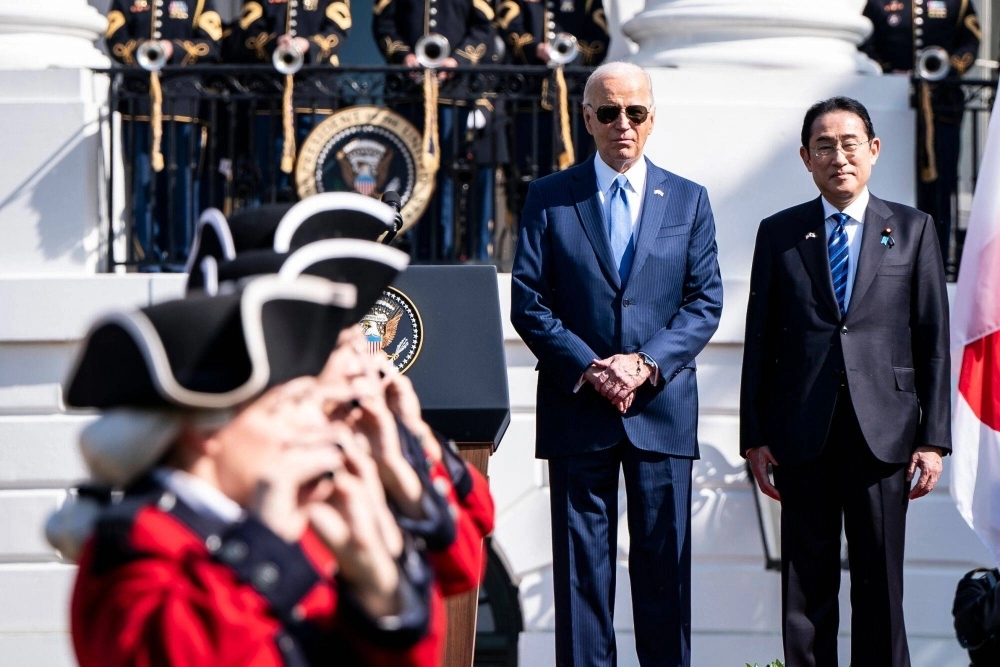 U.S. President Joe Biden and Prime Minister Fumio Kishida attend an an arrival ceremony as part of a state visit by Kishida, on the South Lawn of the White House in Washington on Wednesday.  U.S. President Joe Biden and Prime Minister Fumio Kishida attend an an arrival ceremony as part of a state visit by Kishida, on the South Lawn of the White House in Washington on Wednesday.